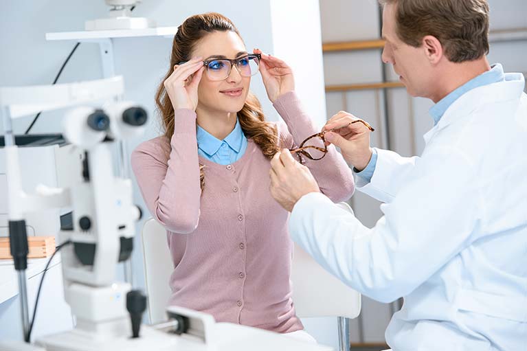 Experienced Eye Doctor fitting lenses